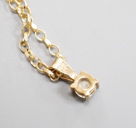 A modern 9ct gold and diamond set pendant, on a 9ct gold chain, chain, 38cm, gross weight 2.2 grams.